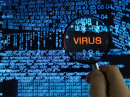 picture of screen with magnifying glass showing the word virus